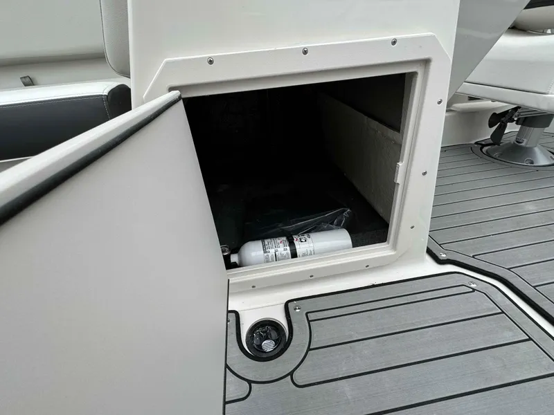 Slide: The Image of Open storage compartment on a 2024 Starcraft SVX 191 OB boat. - 20