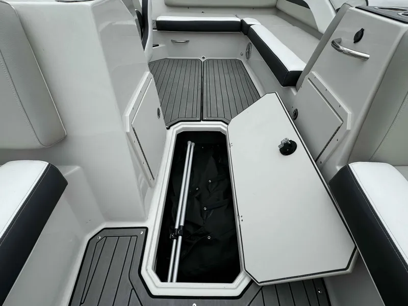 Slide: The Image of 2024 Starcraft SVX 191 OB boat interior with open storage compartment. - 21