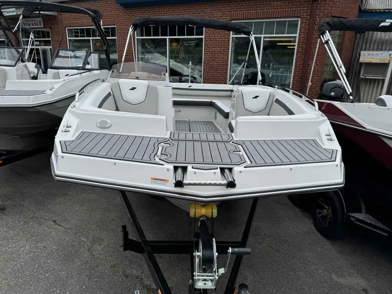 Slide: The Image of 2024 Starcraft SVX 191 OB boat on display at a dealership. - 3