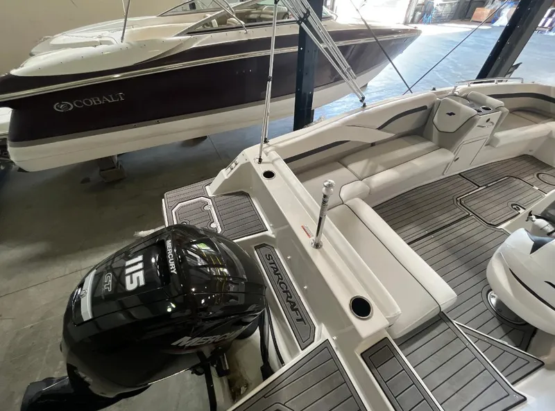 Slide: The Image of 2024 Starcraft SVX 191 OB boat with Mercury 115 engine in showroom. - 6