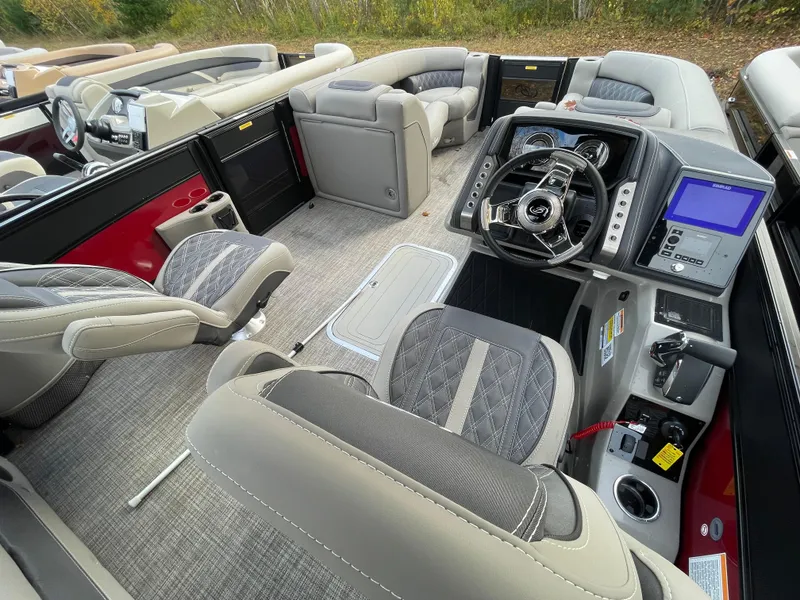 Slide: The Image of 2023 Barletta Lusso 23UCA boat interior with luxurious seating and advanced dashboard. - 11