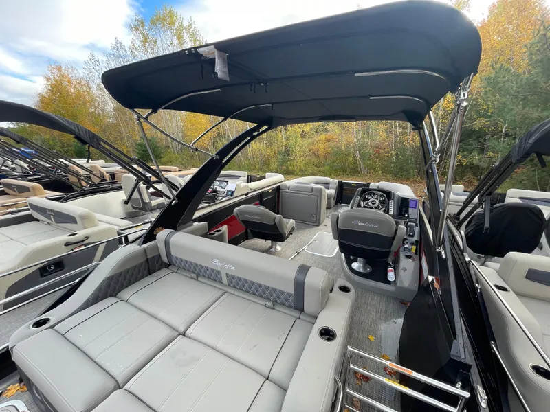 Slide: The Image of 2023 Barletta Lusso 23UCA pontoon boat with luxurious seating and modern helm. - 12