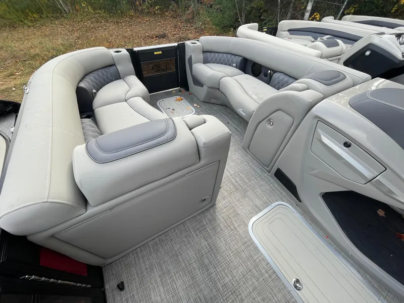 Slide: The Image of 2023 Barletta Lusso 23UCA pontoon boat interior with luxurious seating and modern design. - 14