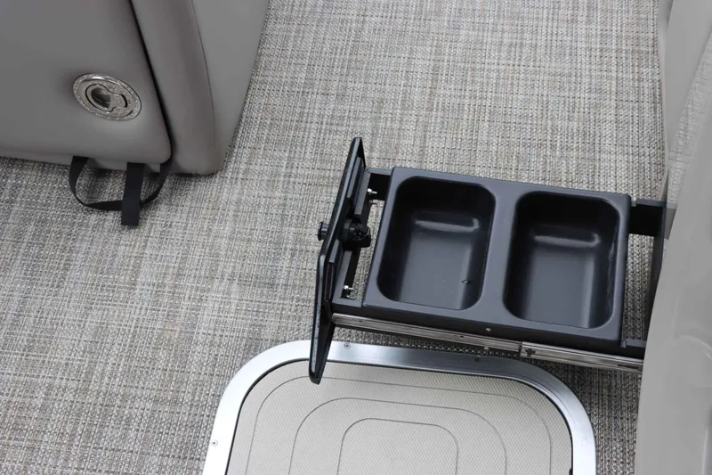 Slide: The Image of 2023 Barletta Lusso 23UCA interior with retractable cup holder on textured flooring. - 20