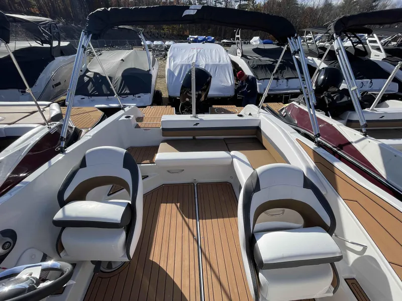 Slide: The Image of 2023 Starcraft SVX 210 OB boat interior with seating and deck view. - 13