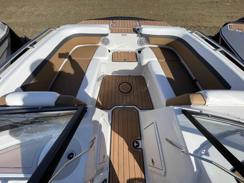 Slide: The Image of 2023 Starcraft SVX 210 OB boat interior with tan and white seating. - 14