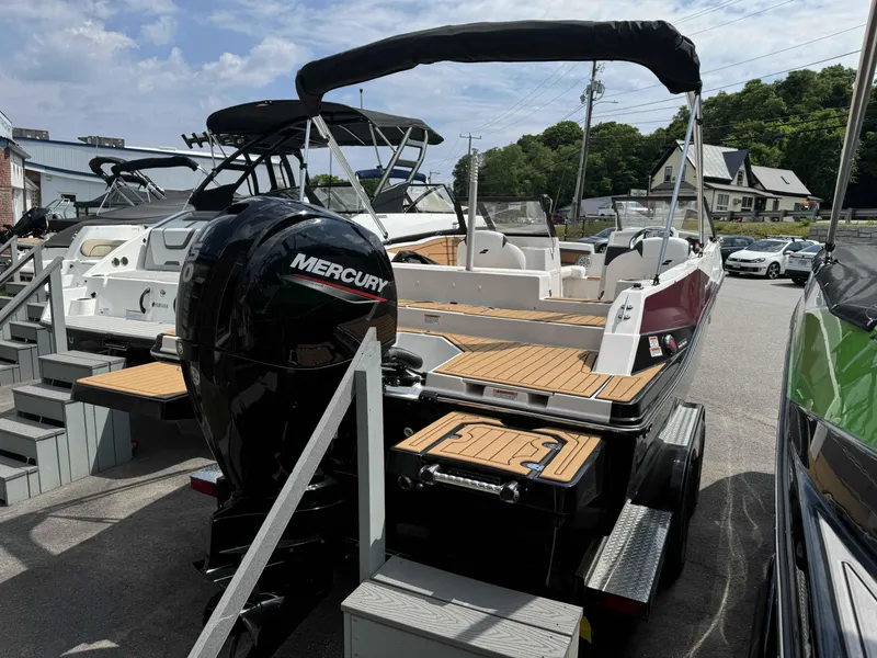 Slide: The Image of 2023 Starcraft SVX 210 OB boat with Mercury outboard motor in a marina. - 5