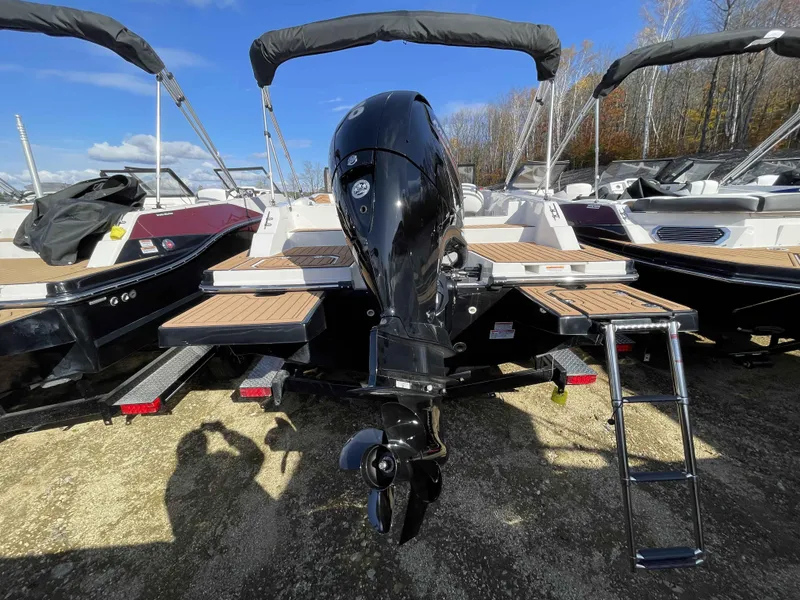 Slide: The Image of 2023 Starcraft SVX 210 OB boat with outboard motor and swim ladder. - 8