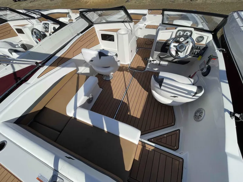 Slide: The Image of 2023 Starcraft SVX 210 OB boat interior with modern seating and dashboard. - 9