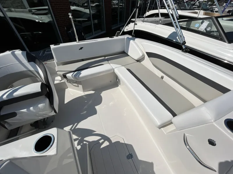 Slide: The Image of 2023 Starcraft SVX 171 OB boat interior with white and gray seating. - 4