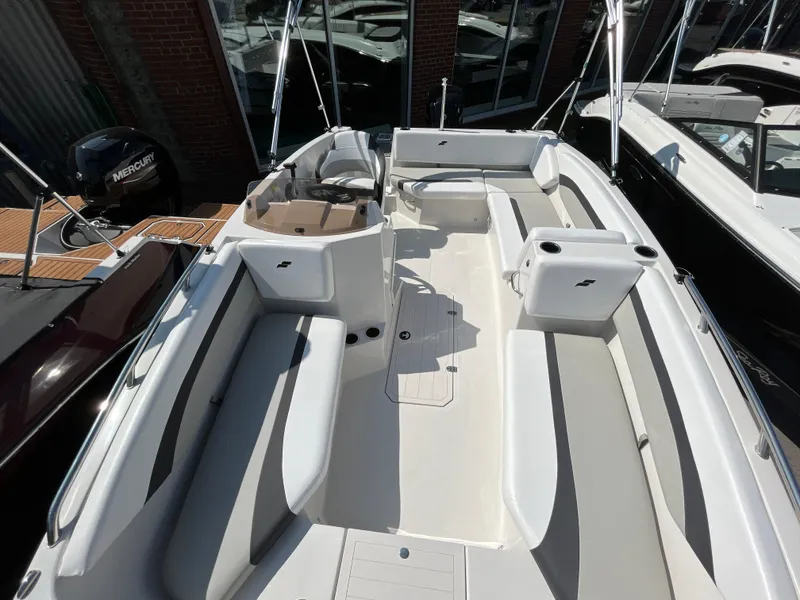 Slide: The Image of 2023 Starcraft SVX 171 OB boat interior with seating and steering console. - 5