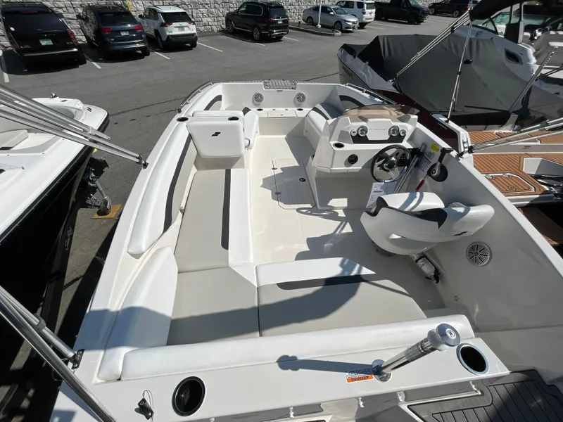 Slide: The Image of 2023 Starcraft SVX 171 OB boat interior with seating and steering console. - 8