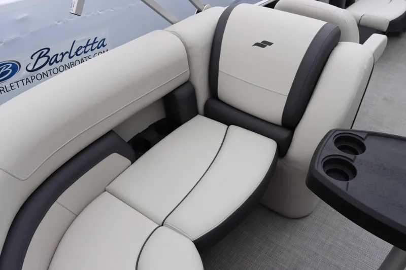 Slide: The Image of Luxurious seating on the 2024 Starcraft EX 20R pontoon boat with cup holders and premium upholstery. - 15