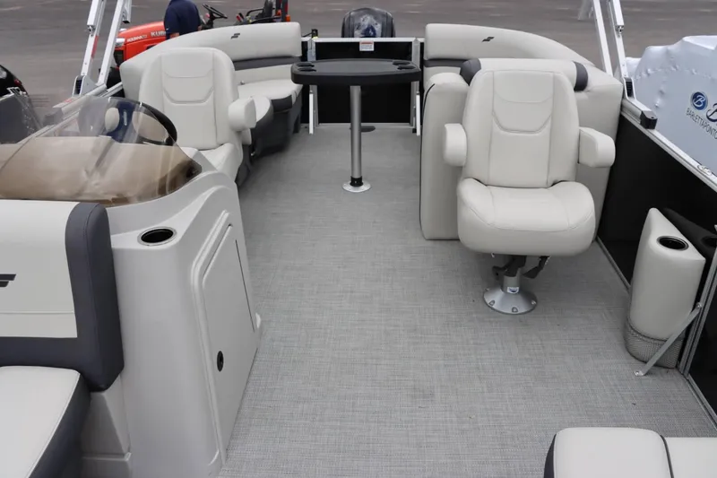 Slide: The Image of Interior of 2024 Starcraft EX 20R pontoon boat with seating and table. - 20