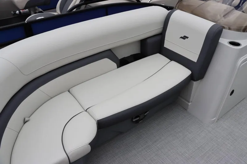 Slide: The Image of 2024 Starcraft EX 20R boat interior with white and gray cushioned seating. - 21