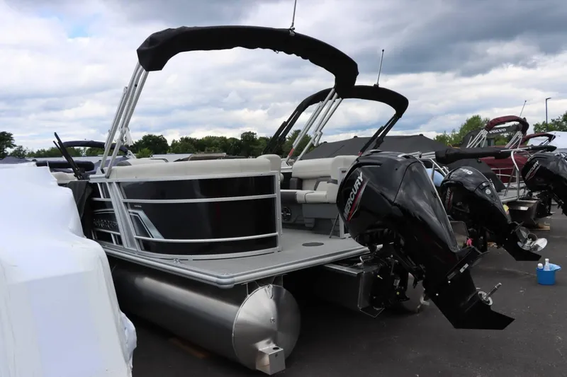 Slide: The Image of 2024 Starcraft EX 20R pontoon boat with Mercury outboard motor. - 4
