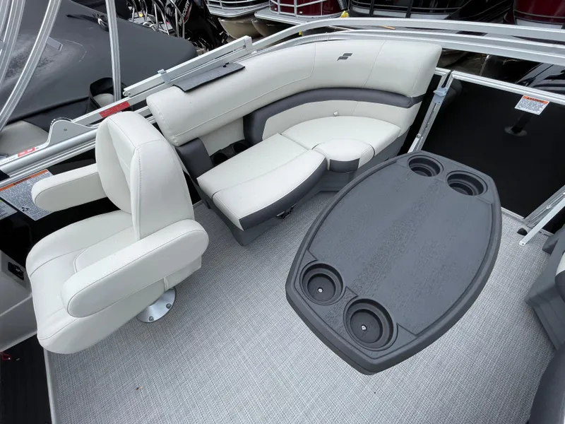 Slide: The Image of 2024 Starcraft EX 20R boat interior with seating and table. - 7