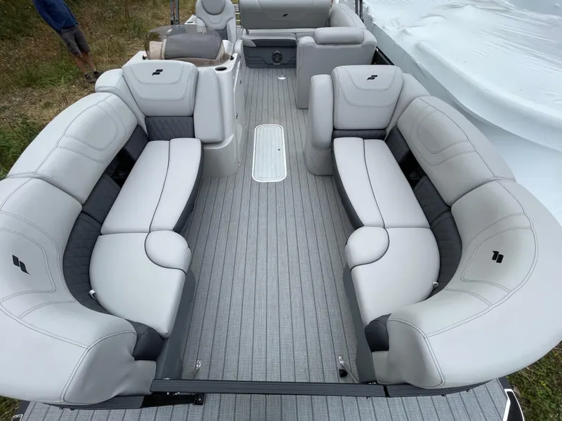 Slide: The Image of 2023 Starcraft CX 25DL BAR pontoon boat with luxurious seating and modern design. - 11