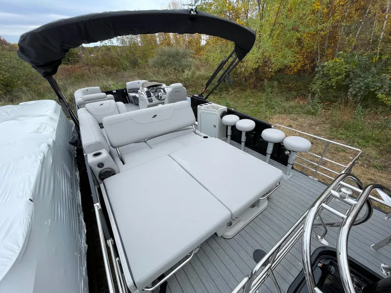 Slide: The Image of 2023 Starcraft CX 25DL BAR pontoon boat with spacious seating and modern design. - 3