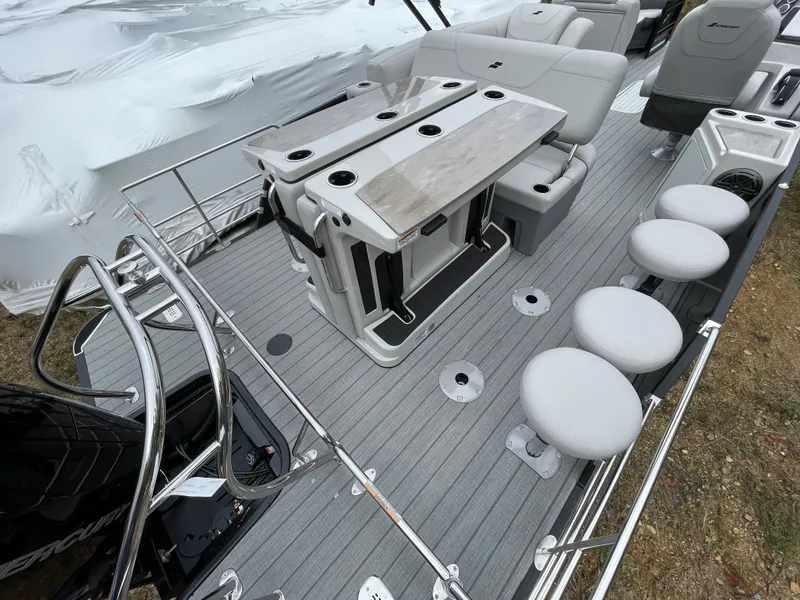 Slide: The Image of 2023 Starcraft CX 25DL BAR boat interior with seating and table. - 4