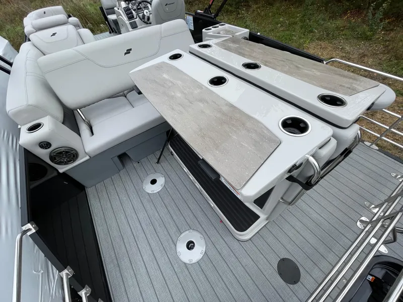 Slide: The Image of 2023 Starcraft CX 25DL BAR boat interior with seating and table. - 5