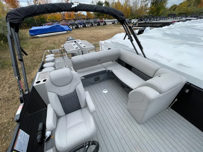 Slide: The Image of 2023 Starcraft CX 25DL BAR pontoon boat with luxurious seating and modern design. - 8