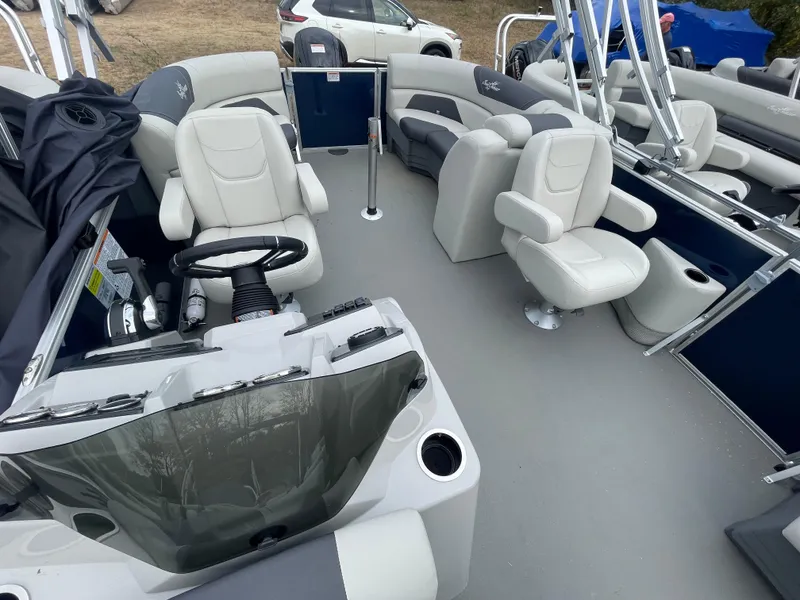 Slide: The Image of 2023 SunChaser GENEVA 20LR DH pontoon boat interior with white seating and steering console. - 3