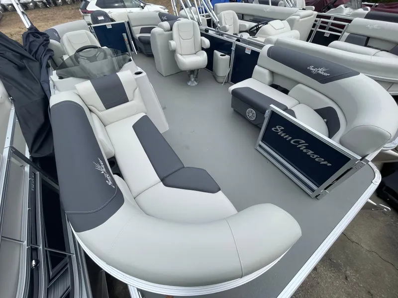 Slide: The Image of 2023 SunChaser GENEVA 20LR DH pontoon boat interior with plush seating and steering console. - 7