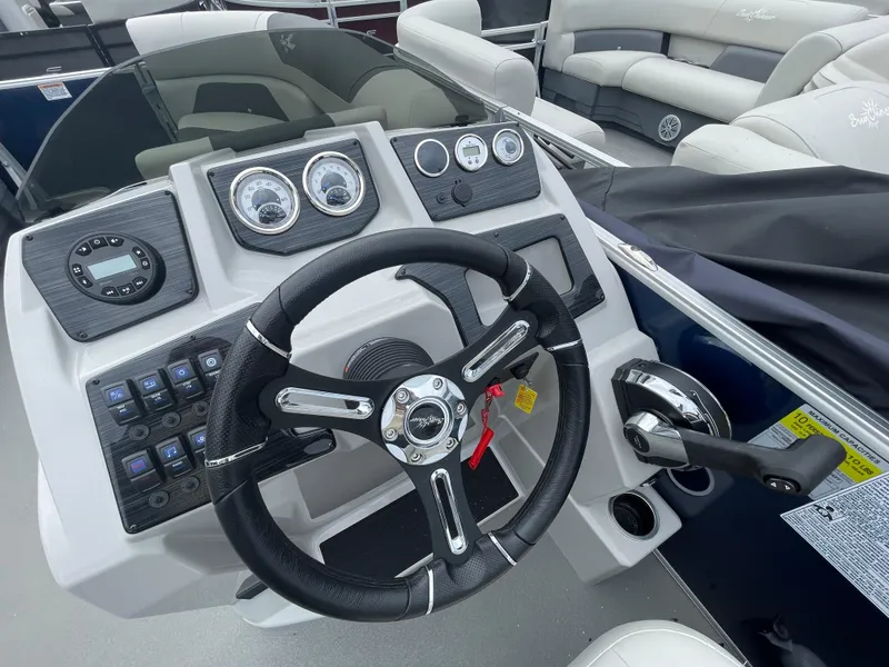 Slide: The Image of 2023 SunChaser GENEVA 20LR DH boat dashboard with steering wheel and control panel. - 9