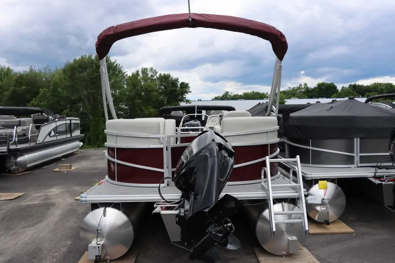 Slide: The Image of 2024 SunChaser VISTA 18LR pontoon boat with outboard motor and canopy. - 5