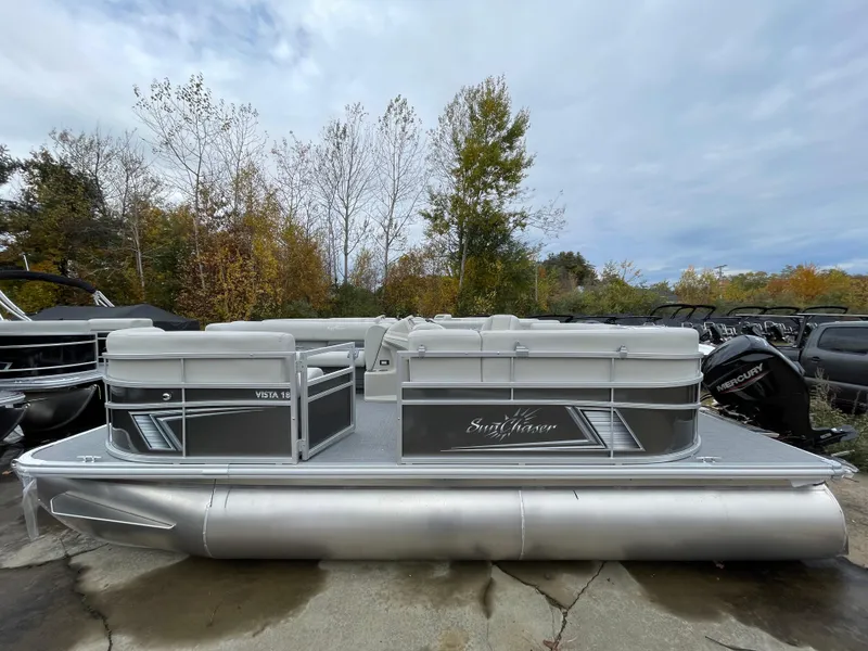 Slide: The Image of 2024 SunChaser VISTA 18LR pontoon boat in outdoor setting. - 1
