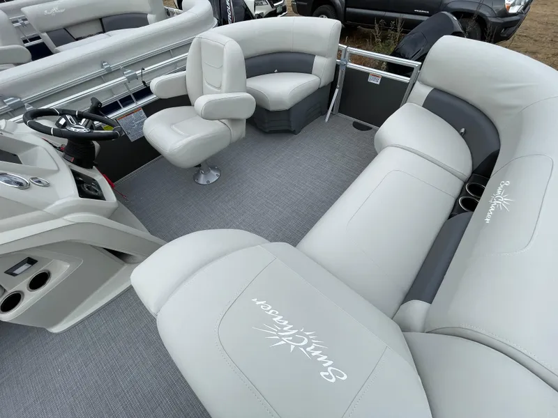 Slide: The Image of 2024 SunChaser VISTA 18LR boat interior with plush seating and modern helm. - 6