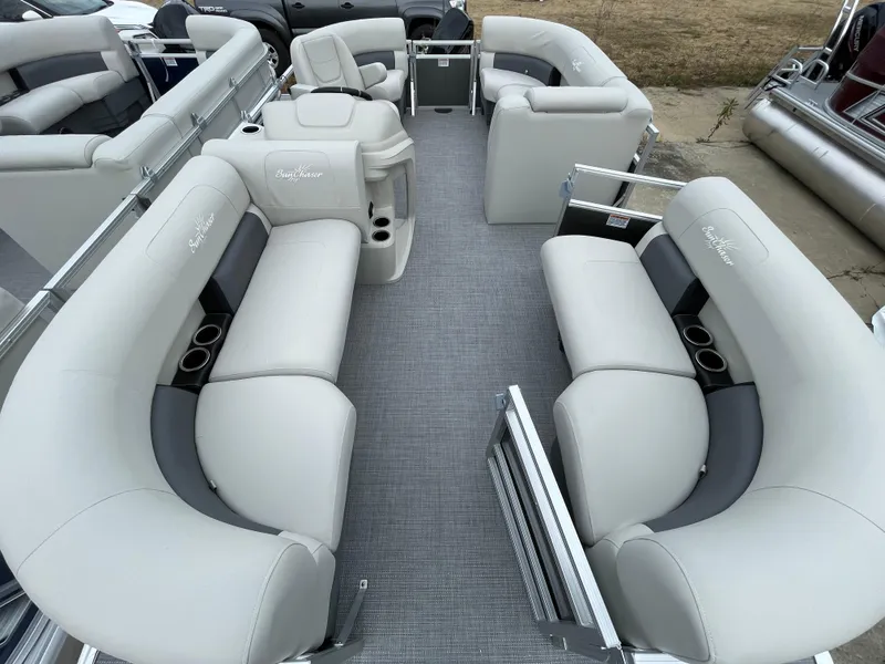 Slide: The Image of 2024 SunChaser VISTA 18LR pontoon boat interior with plush seating and cup holders. - 8