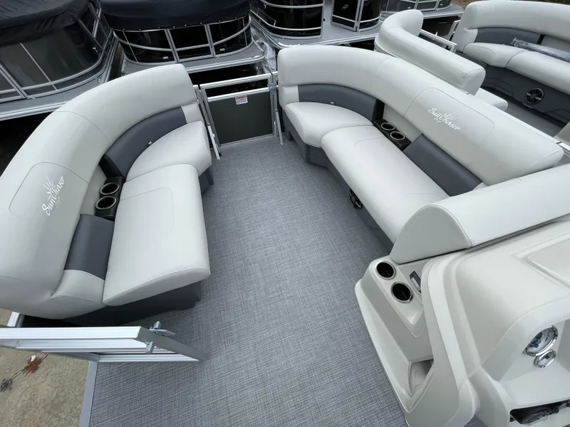 Slide: The Image of 2024 SunChaser VISTA 18LR pontoon boat interior with spacious seating and cup holders. - 9