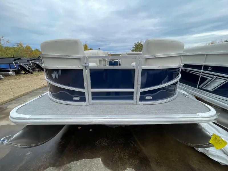 Slide: The Image of 2024 SunChaser VISTA 18LR pontoon boat, rear view, docked outdoors. - 3