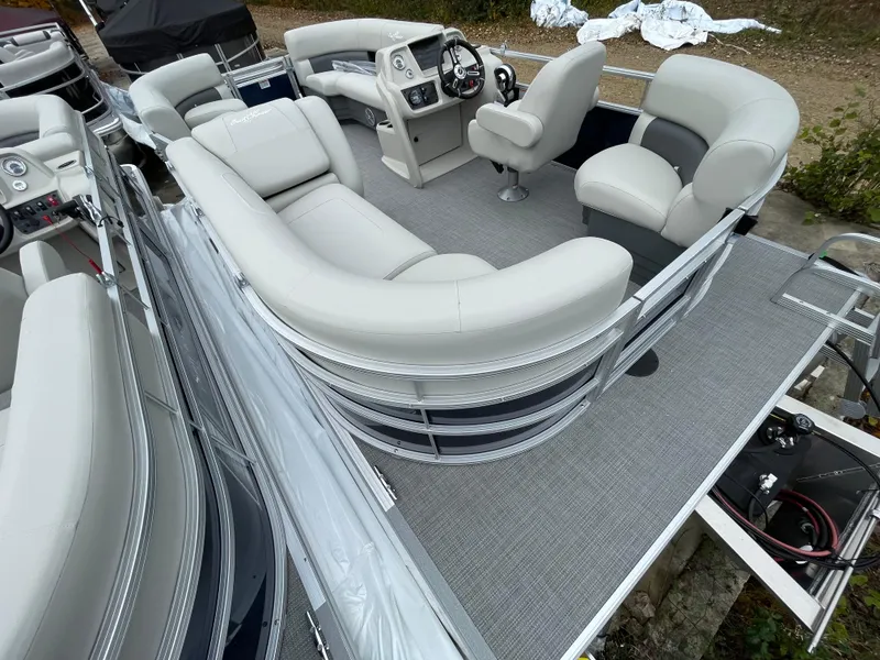 Slide: The Image of 2024 SunChaser VISTA 18LR pontoon boat with spacious seating and modern helm. - 4
