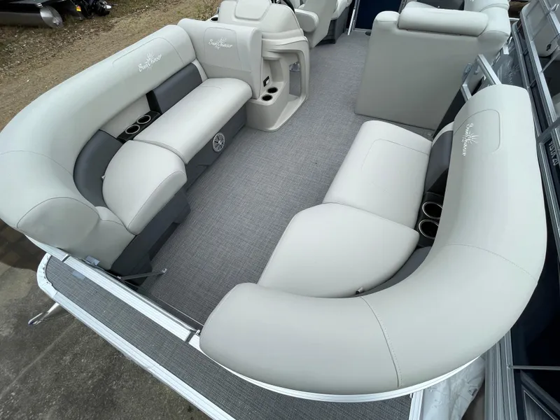 Slide: The Image of 2024 SunChaser VISTA 18LR pontoon boat interior with plush seating and cup holders. - 6