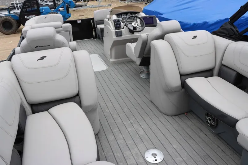 Slide: The Image of 2023 Starcraft SLS 3 boat interior with luxurious seating and modern dashboard. - 19