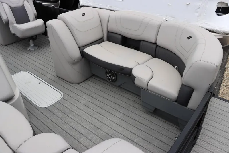 Slide: The Image of 2023 Starcraft SLS 3 boat interior with luxurious seating and gray flooring. - 8