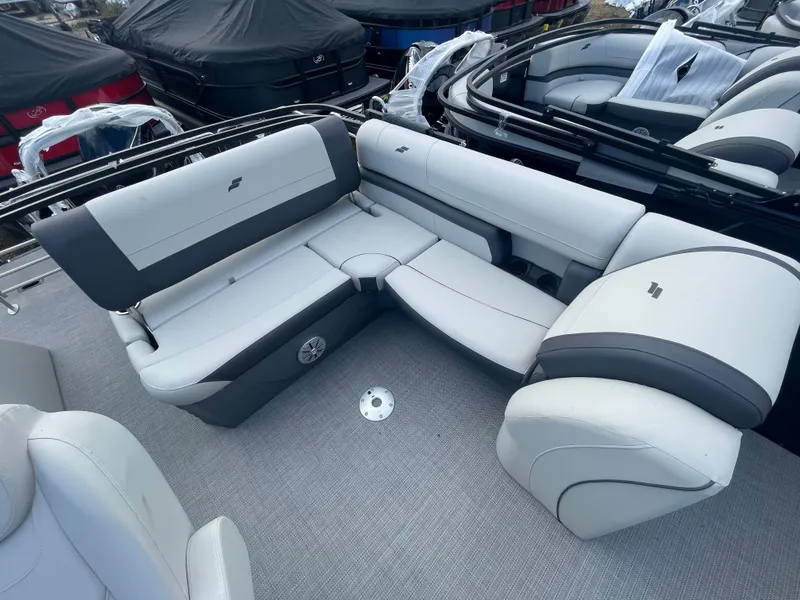 Slide: The Image of 2023 Starcraft EXS 3Q boat interior with gray and white seating. - 11