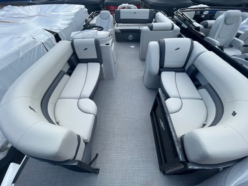 Slide: The Image of 2023 Starcraft EXS 3Q pontoon boat interior with plush seating and modern design. - 13