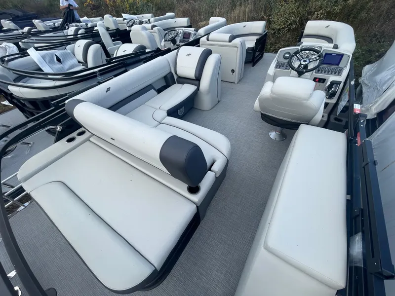 Slide: The Image of 2023 Starcraft EXS 3Q pontoon boat interior with plush seating and modern helm. - 15