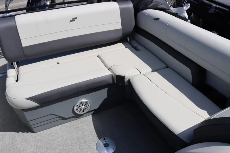 Slide: The Image of 2023 Starcraft EXS 3Q boat interior seating with built-in speaker. - 22
