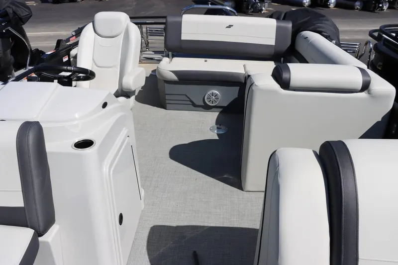 Slide: The Image of 2023 Starcraft EXS 3Q boat interior with white and gray seating. - 23