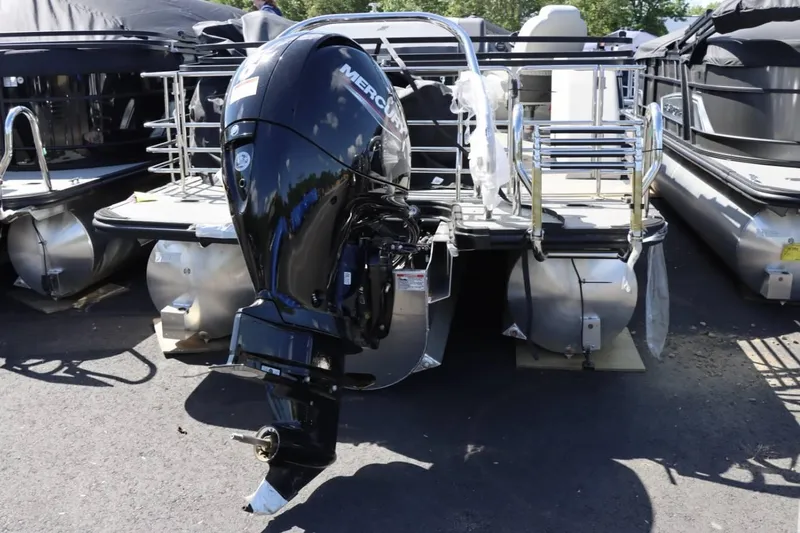 Slide: The Image of 2023 Starcraft EXS 3Q pontoon boat with Mercury outboard motor. - 7