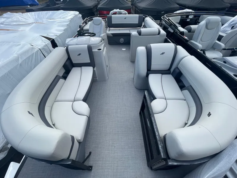 Slide: The Image of 2023 Starcraft EXS 3Q pontoon boat interior with plush seating and modern design. - 9
