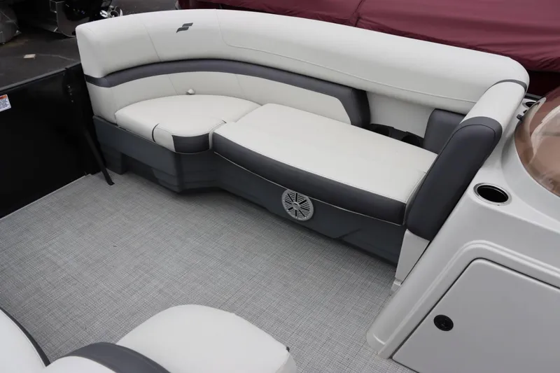 Slide: The Image of 2024 Starcraft EXS 3 boat interior with cushioned seating and speaker. - 10