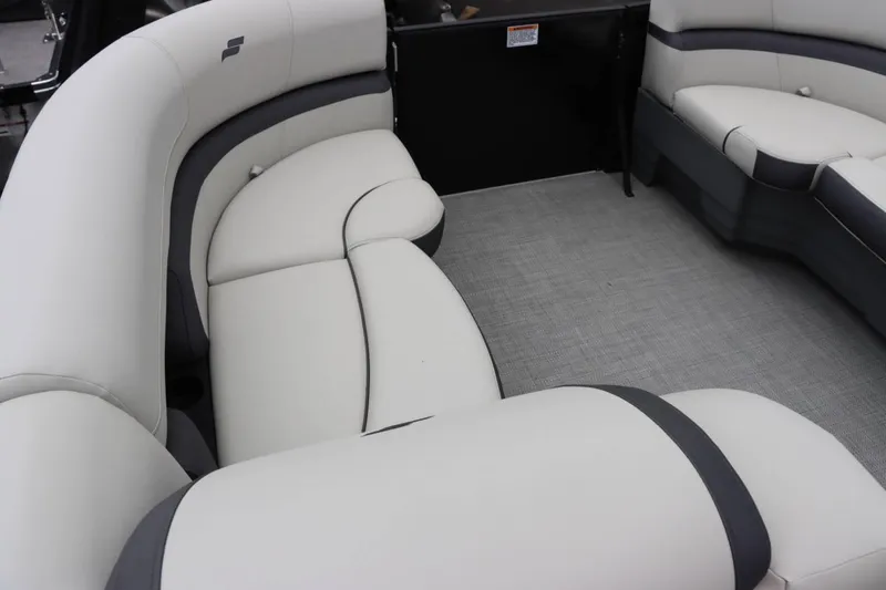 Slide: The Image of 2024 Starcraft EXS 3 boat interior with white and gray cushioned seating. - 11
