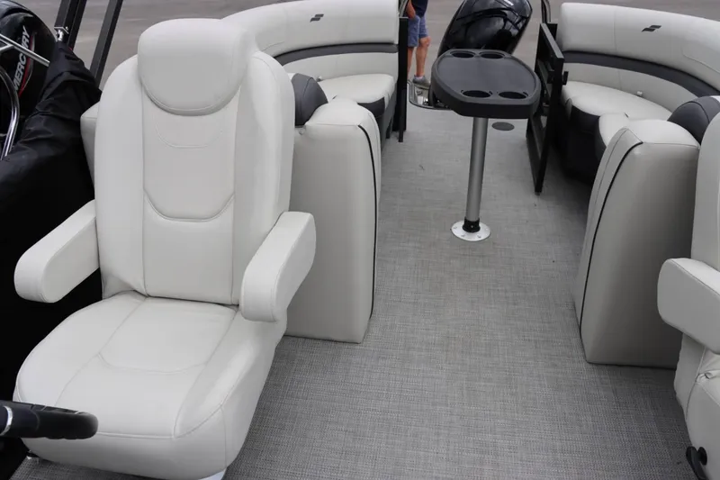 Slide: The Image of 2024 Starcraft EXS 3 boat interior with plush seating and table. - 14