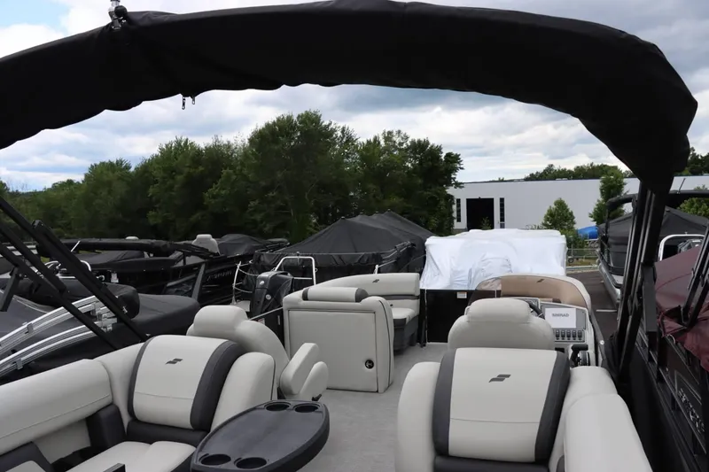 Slide: The Image of 2024 Starcraft EXS 3 pontoon boat with spacious seating and modern design. - 15